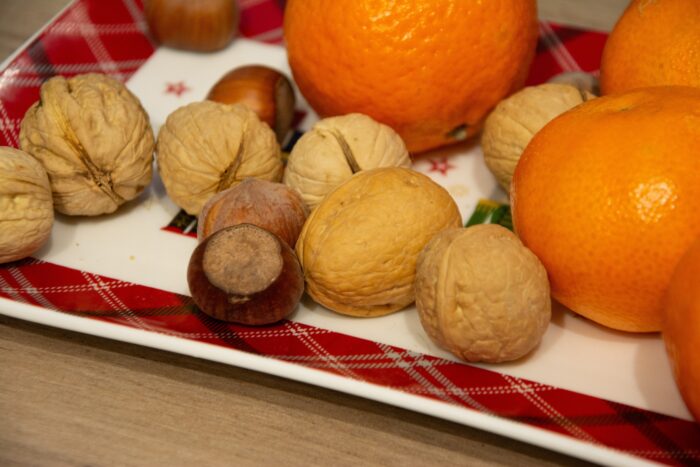 Nuts and tangerines on a Christmas plate