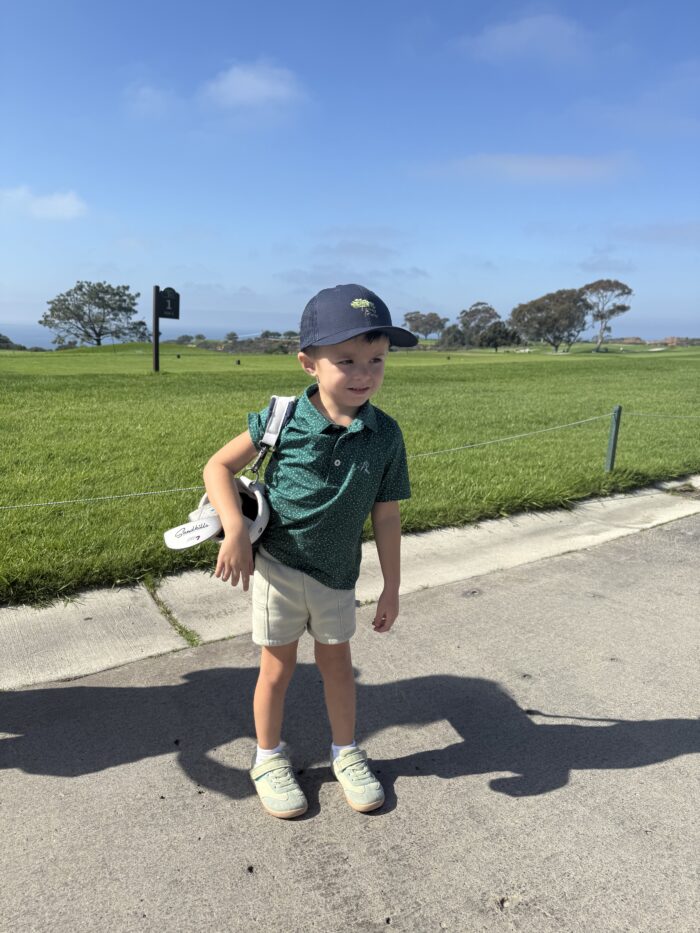 Jack, golf club in hand—ready to play, ready to move forward.