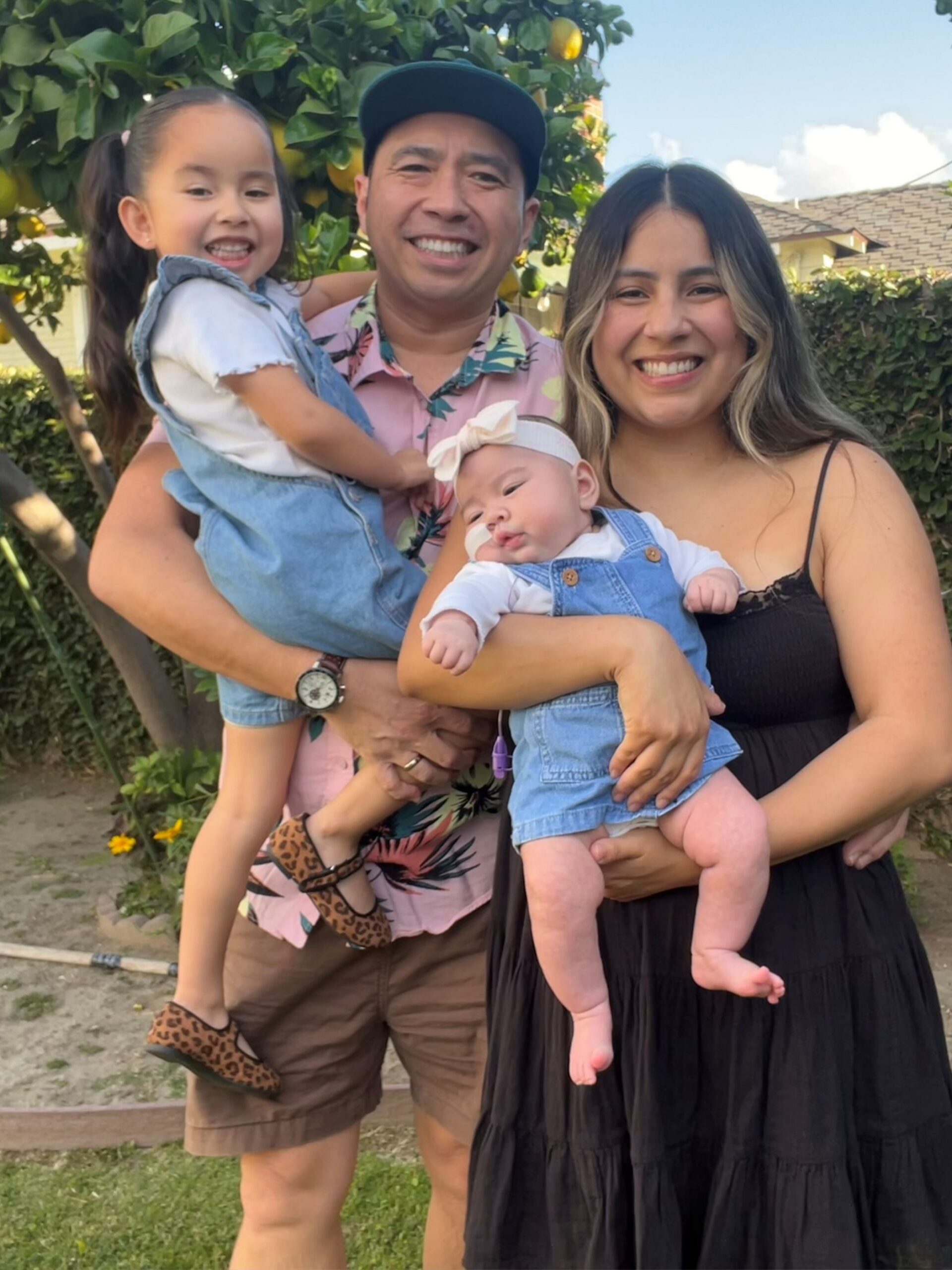 Happy parents with two children.