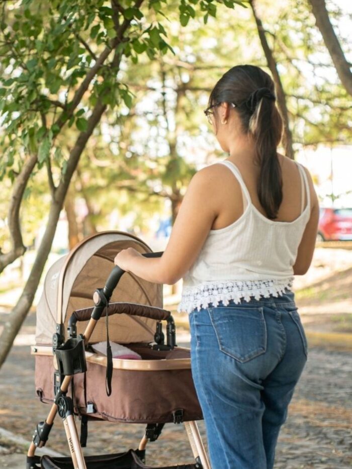 Woman walking baby in stroller