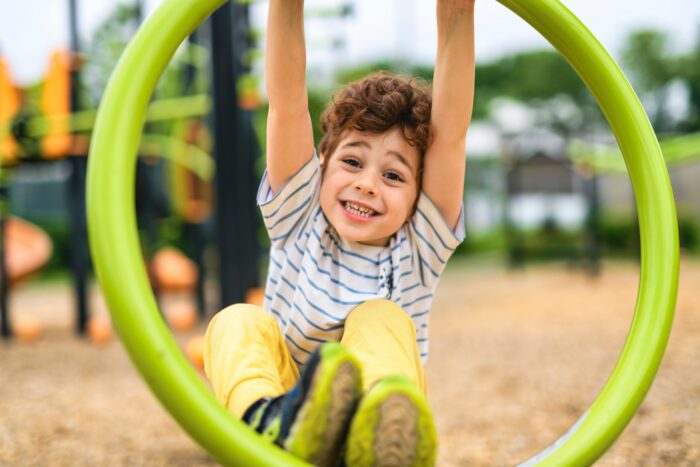 A Happy kid on playground on summer season